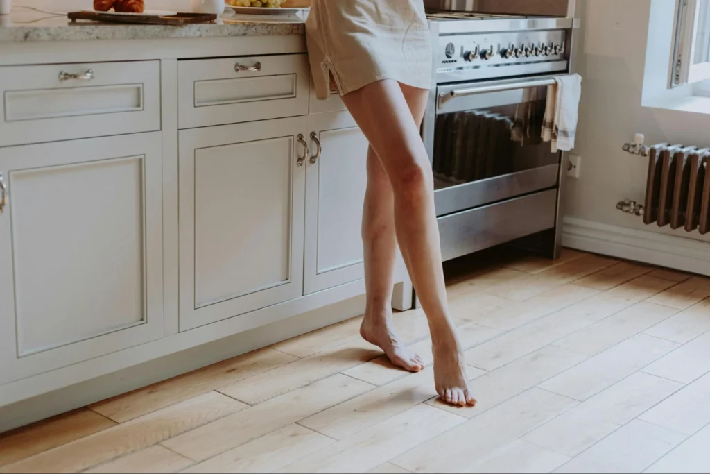 do you floor under kitchen cabinets