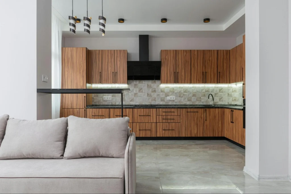do you floor under kitchen cabinets